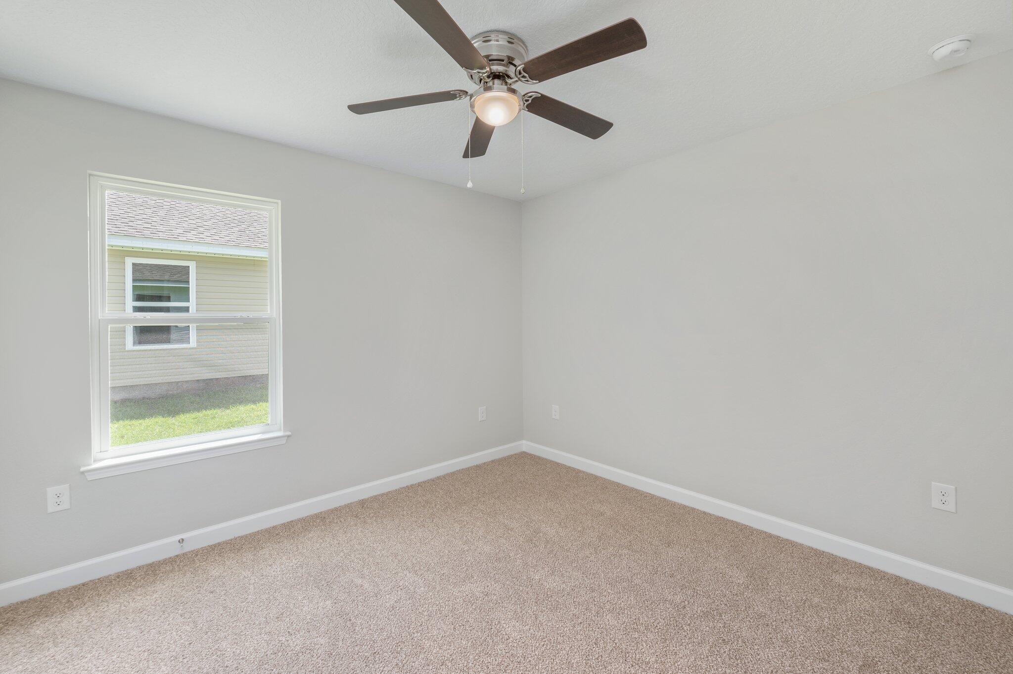 3158 Chestnut Street Crestview, FL 32539 - Photo 20 of 26 an empty room with a window and a fan