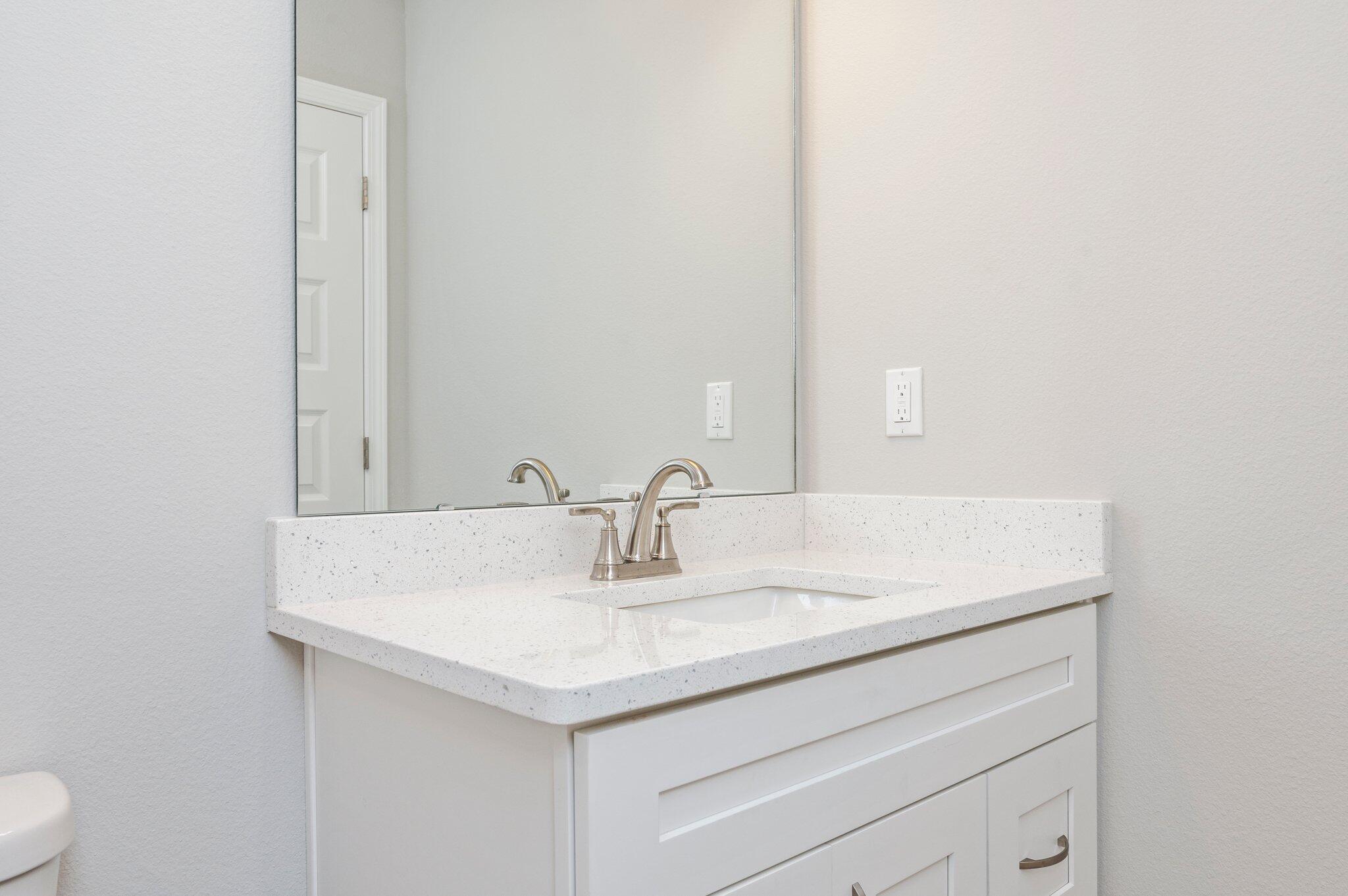 3158 Chestnut Street Crestview, FL 32539 - Photo 24 of 26 a bathroom with a sink and a mirror