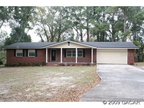 157 Northwest County Road Lake City, FL 32025 - Photo 1 of 1 front view of a house and a yard
