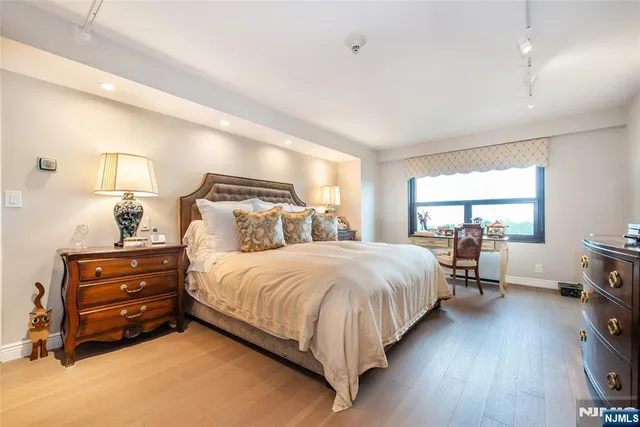 a bed room with a bed and a window