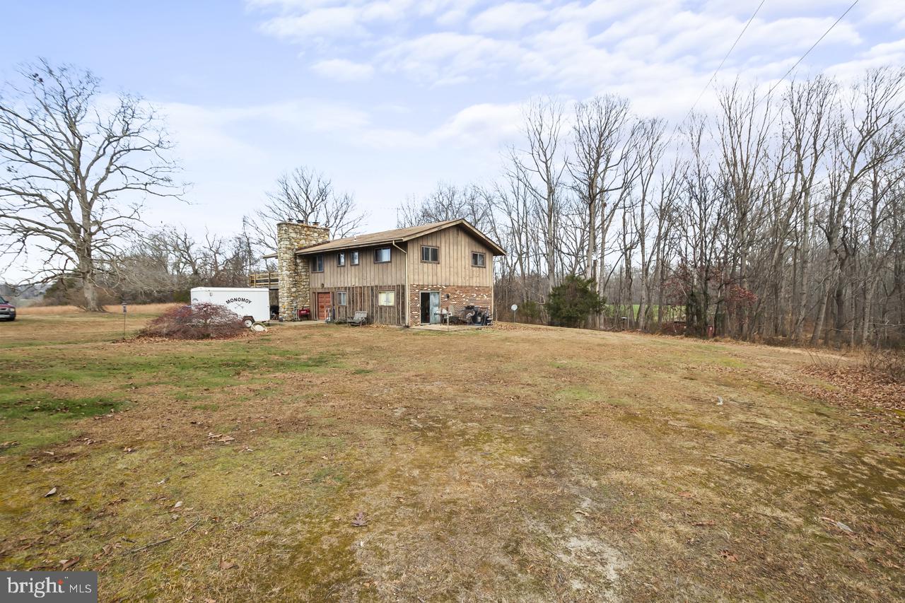 7389 Leeds Manor Road Marshall, VA 20115 - Photo 18 of 33 a front view of house with yard and trees around