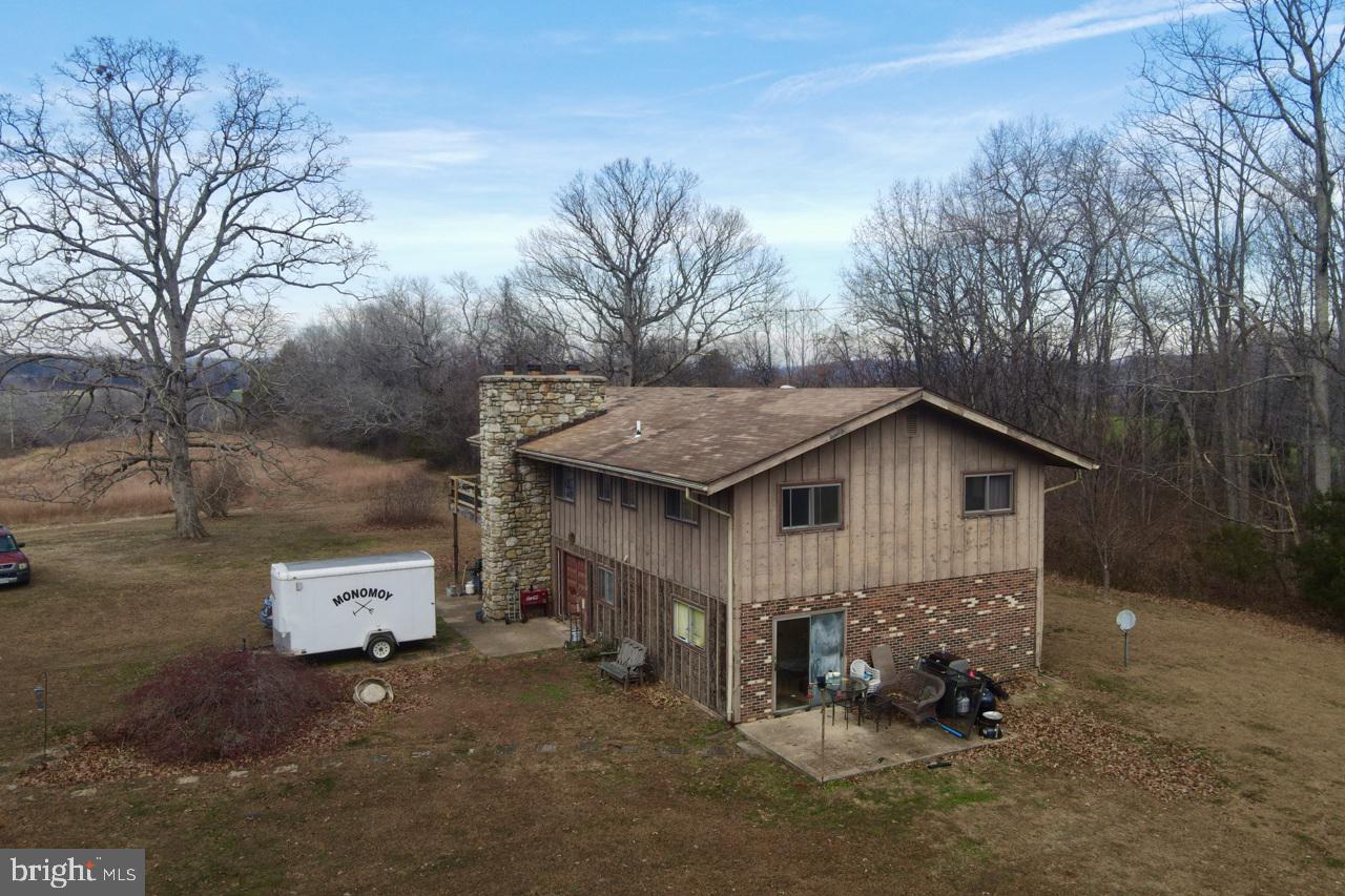 7389 Leeds Manor Road Marshall, VA 20115 - Photo 23 of 33 a view of a house with a yard and large tree