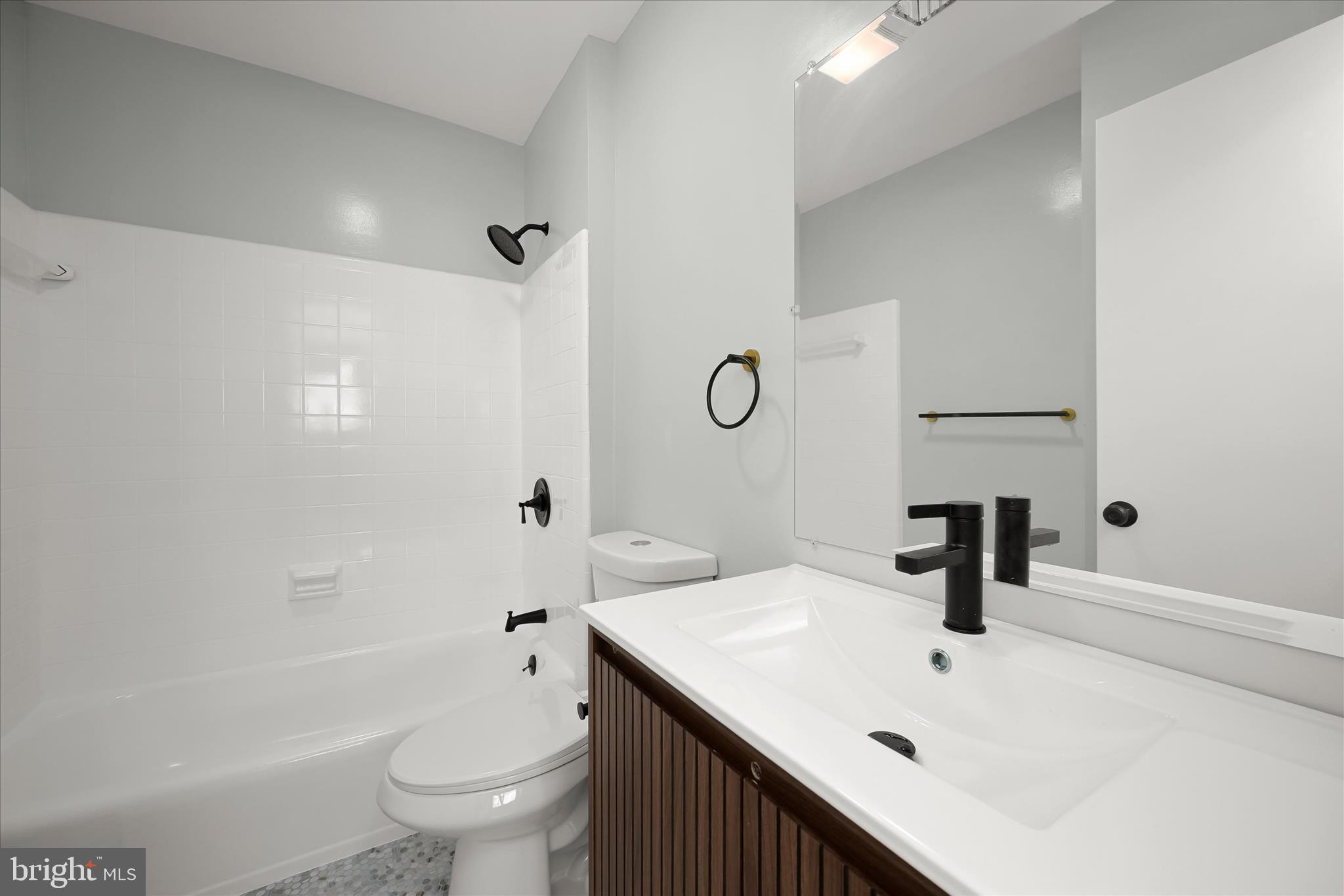 9720 Hedin Drive Silver Spring, MD 20903 - Photo 46 of 79 a bathroom with a sink a toilet and shower