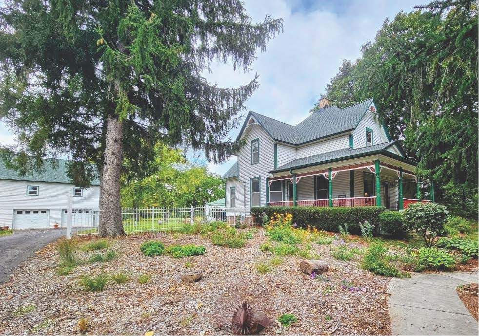 3019 North Ringwood Road McHenry, IL 60050 - Photo 1 of 2 a front view of a house with a garden