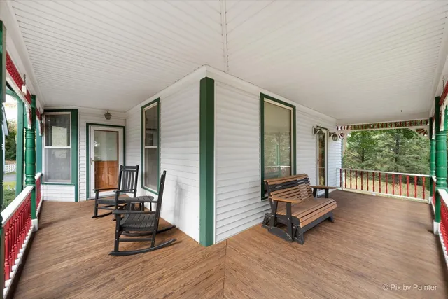a building outdoor space with patio furniture and windows