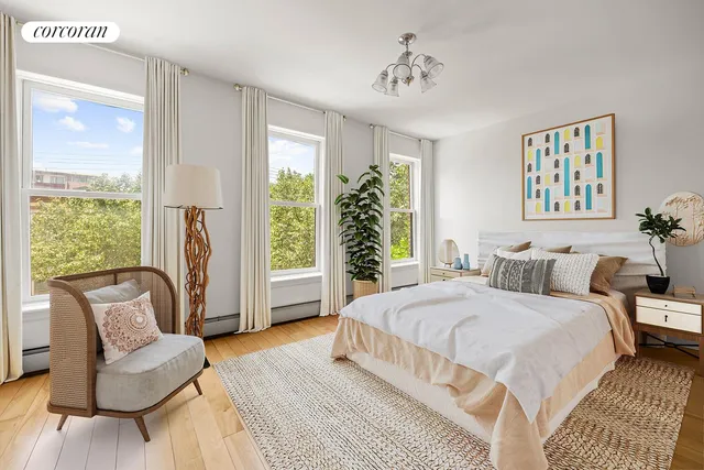 a kitchen with stainless steel appliances granite countertop white refrigerator a stove a dining table and chairs with wooden floor