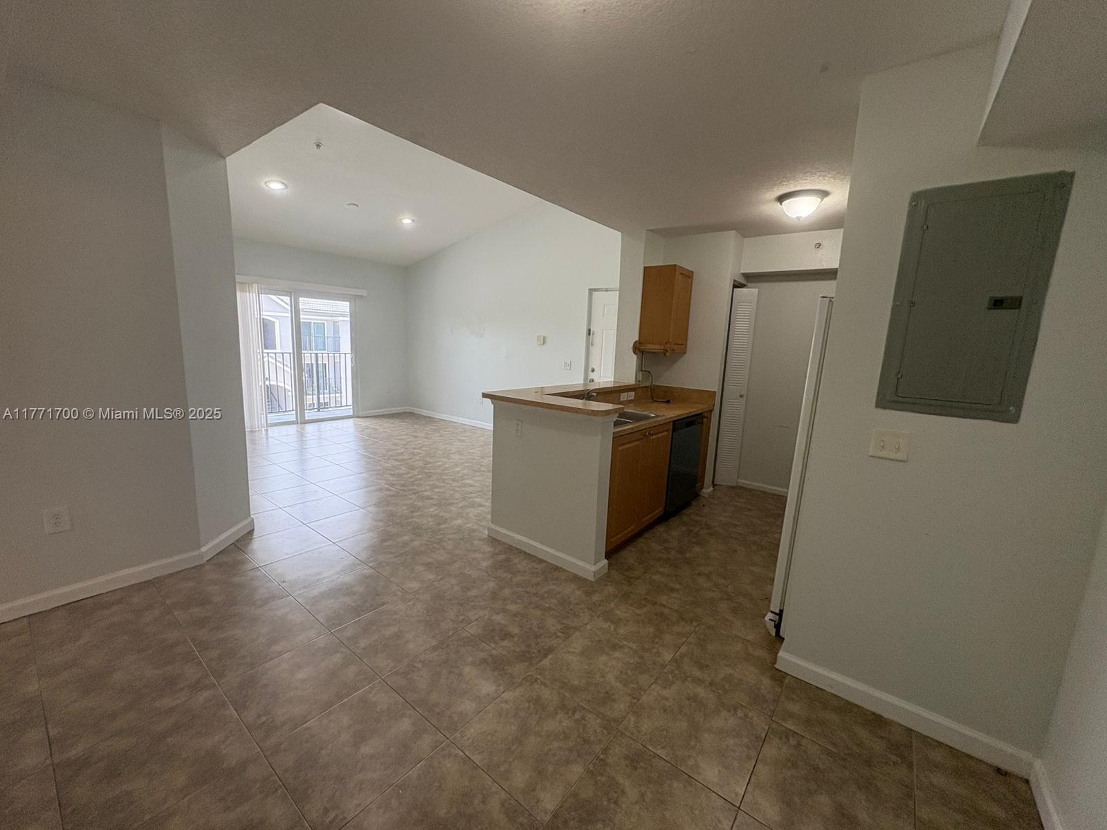 15422 Southwest 284th Street, Unit 7302 Homestead, FL 33033 - Photo 13 of 44 a view of a kitchen with a sink and dishwasher a stove top oven with wooden floor
