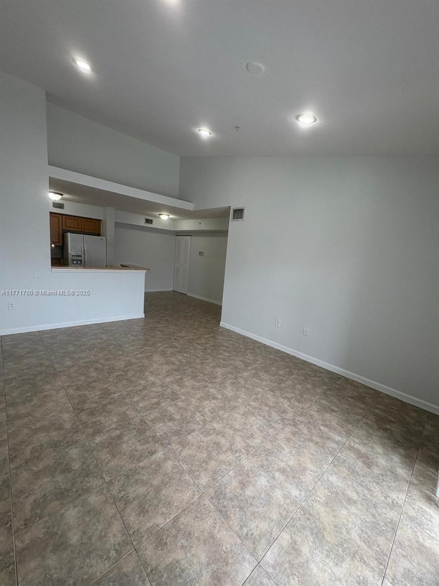15422 Southwest 284th Street, Unit 7302 Homestead, FL 33033 - Photo 15 of 44 a view of a livingroom with an empty space