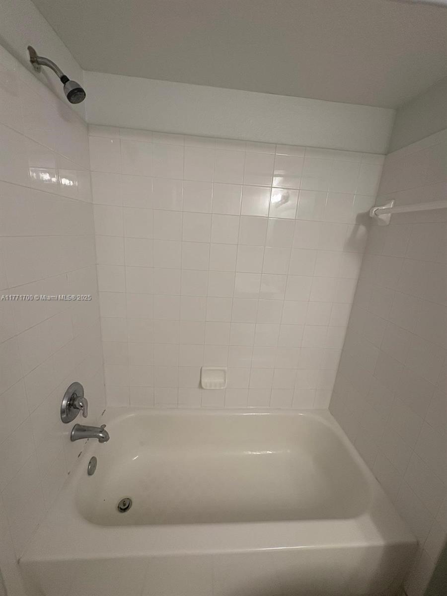 15422 Southwest 284th Street, Unit 7302 Homestead, FL 33033 - Photo 18 of 44 a close up of a bathtub in a bathroom