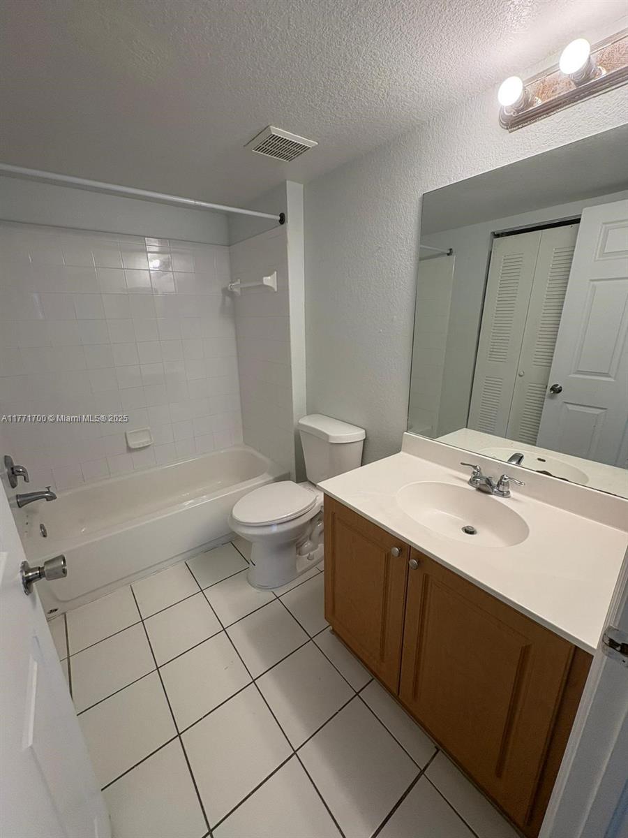 15422 Southwest 284th Street, Unit 7302 Homestead, FL 33033 - Photo 19 of 44 a bathroom with a sink a toilet and shower