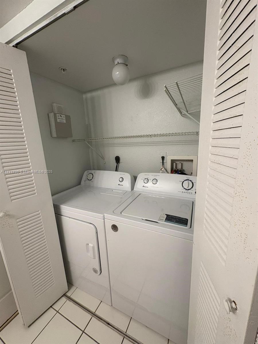 15422 Southwest 284th Street, Unit 7302 Homestead, FL 33033 - Photo 24 of 44 a utility room with dryer and washer