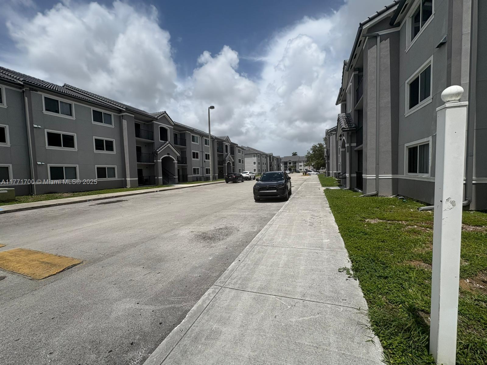 15422 Southwest 284th Street, Unit 7302 Homestead, FL 33033 - Photo 25 of 44 a view of a building with many windows