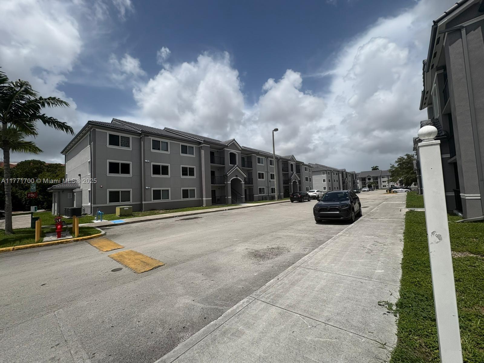 15422 Southwest 284th Street, Unit 7302 Homestead, FL 33033 - Photo 27 of 44 a view of street with parked cars