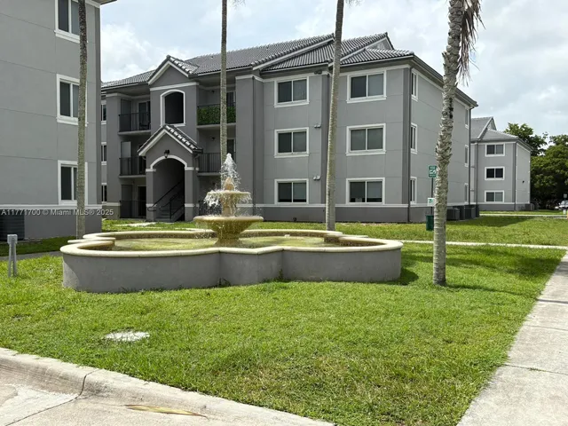 a view of pool with yard