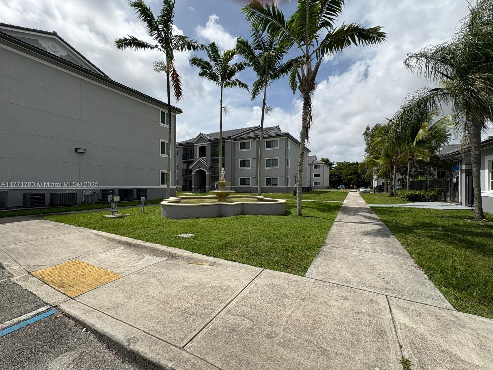 15422 Southwest 284th Street, Unit 7302 Homestead, FL 33033 - Photo 31 of 44 a view of yard with swimming pool and green space