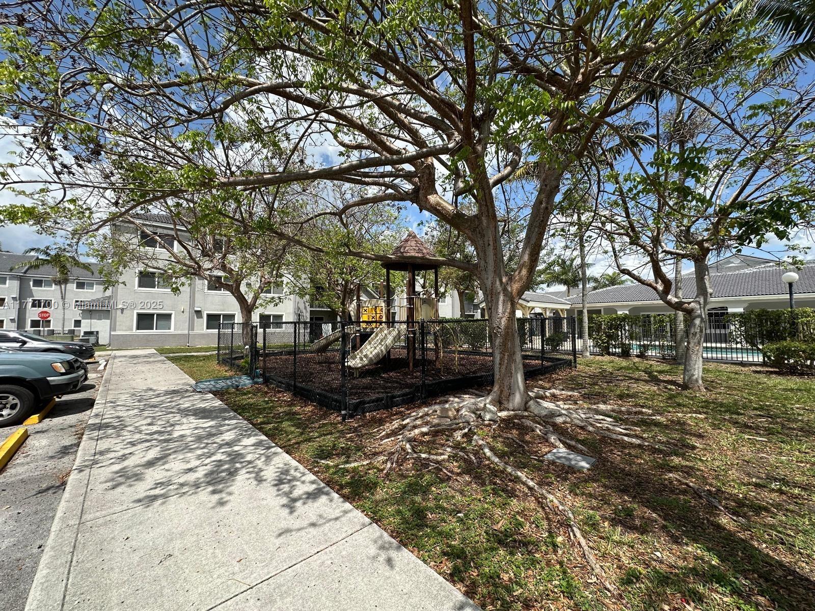 15422 Southwest 284th Street, Unit 7302 Homestead, FL 33033 - Photo 34 of 44 a view of a yard with a large tree