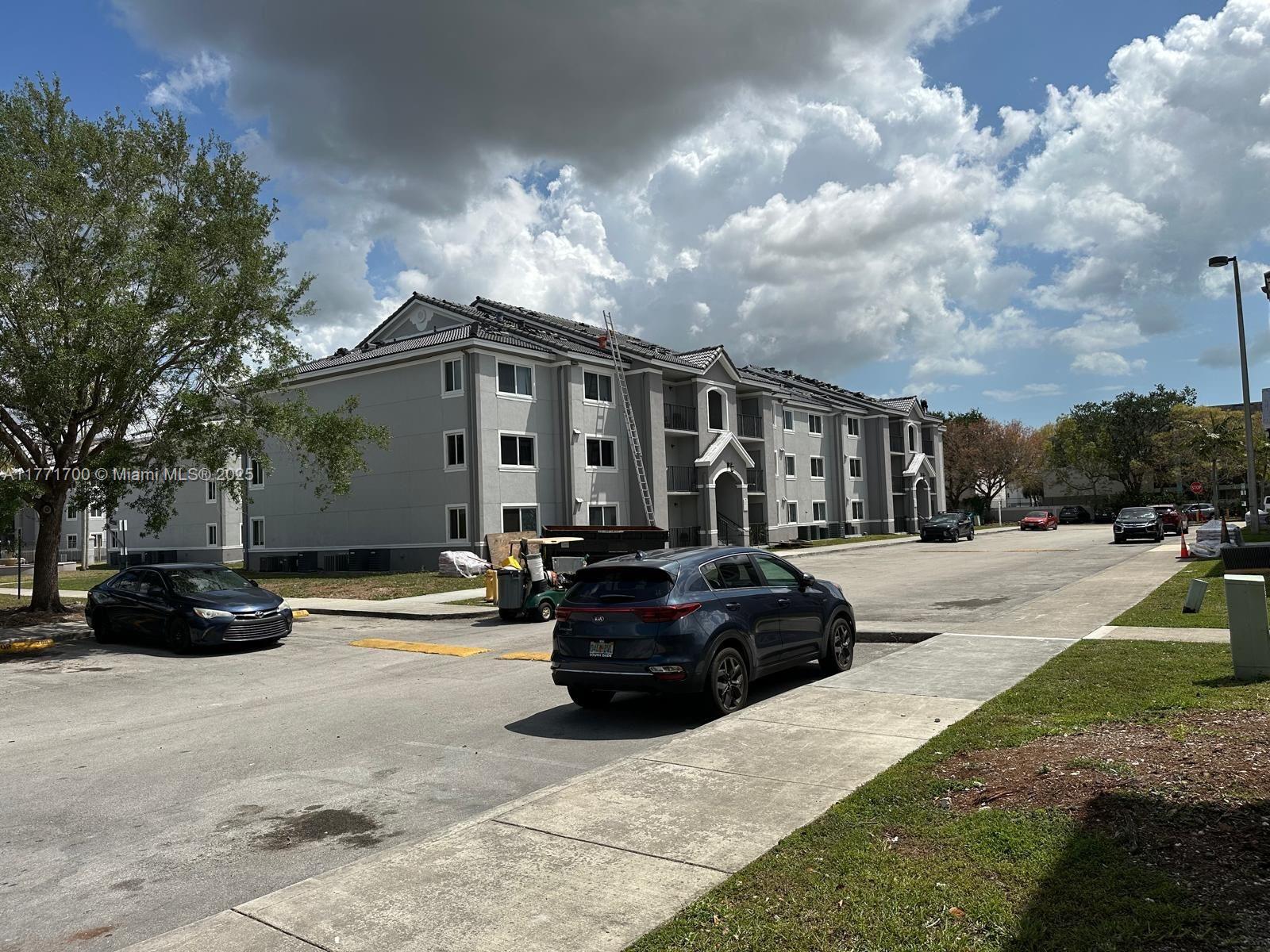 15422 Southwest 284th Street, Unit 7302 Homestead, FL 33033 - Photo 36 of 44 a view of a street with cars