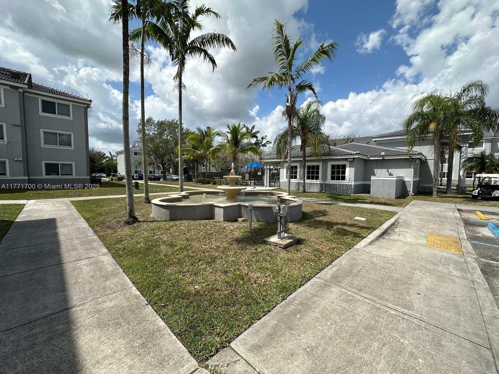 15422 Southwest 284th Street, Unit 7302 Homestead, FL 33033 - Photo 37 of 44 a view of a house with swimming pool and sitting area