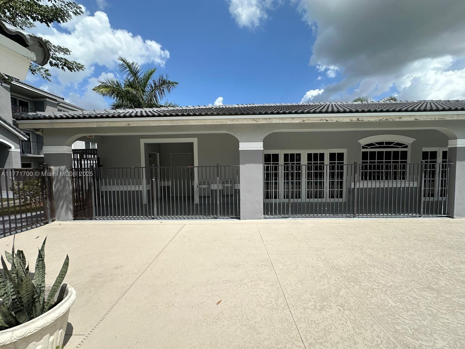 15422 Southwest 284th Street, Unit 7302 Homestead, FL 33033 - Photo 38 of 44 a front view of a building