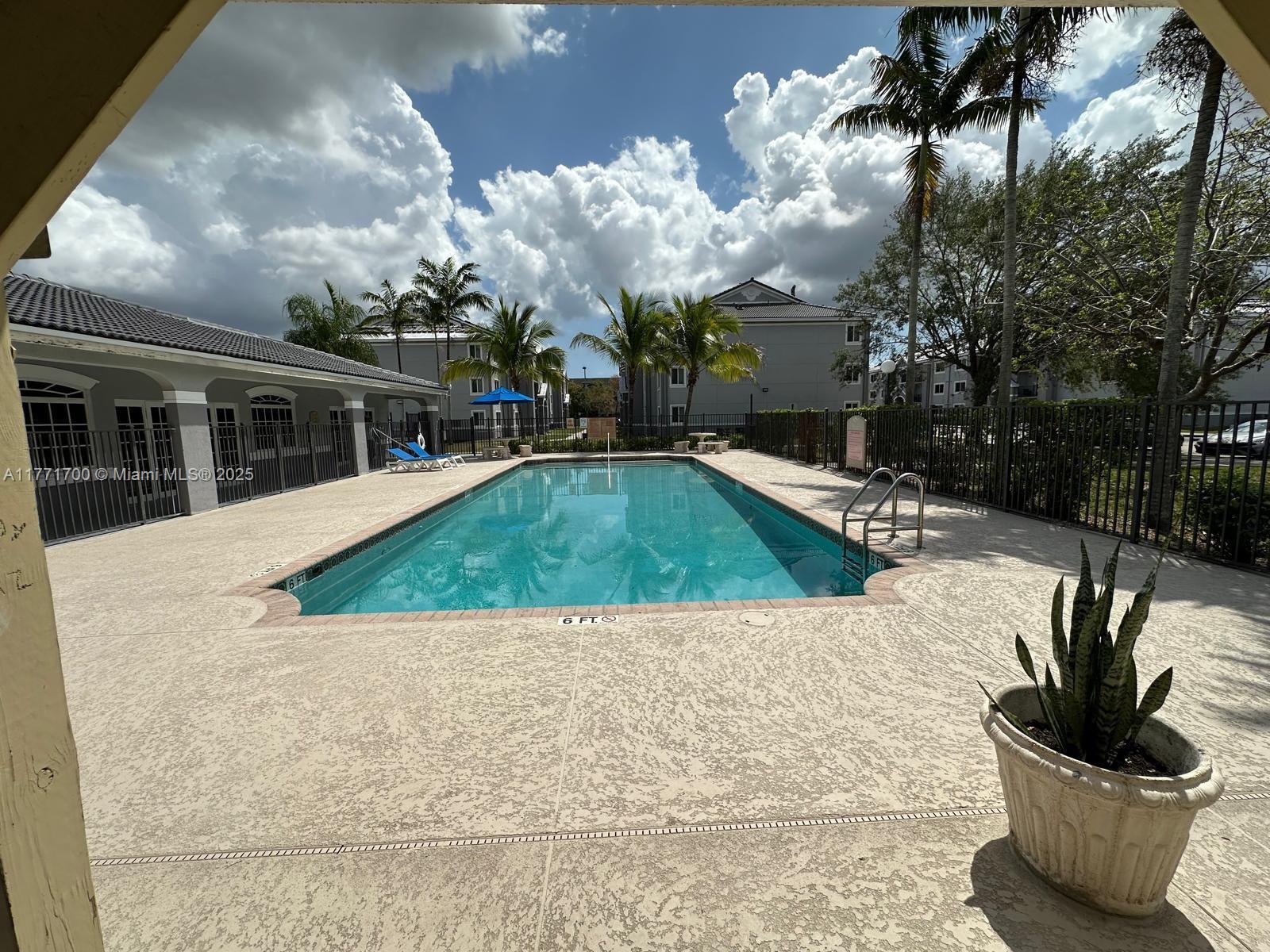 15422 Southwest 284th Street, Unit 7302 Homestead, FL 33033 - Photo 40 of 44 a view of a house with backyard