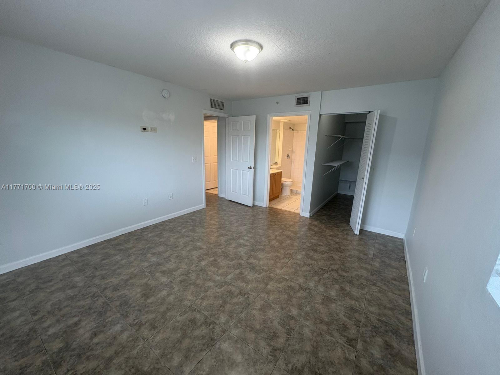 15422 Southwest 284th Street, Unit 7302 Homestead, FL 33033 - Photo 5 of 44 a view of an empty room