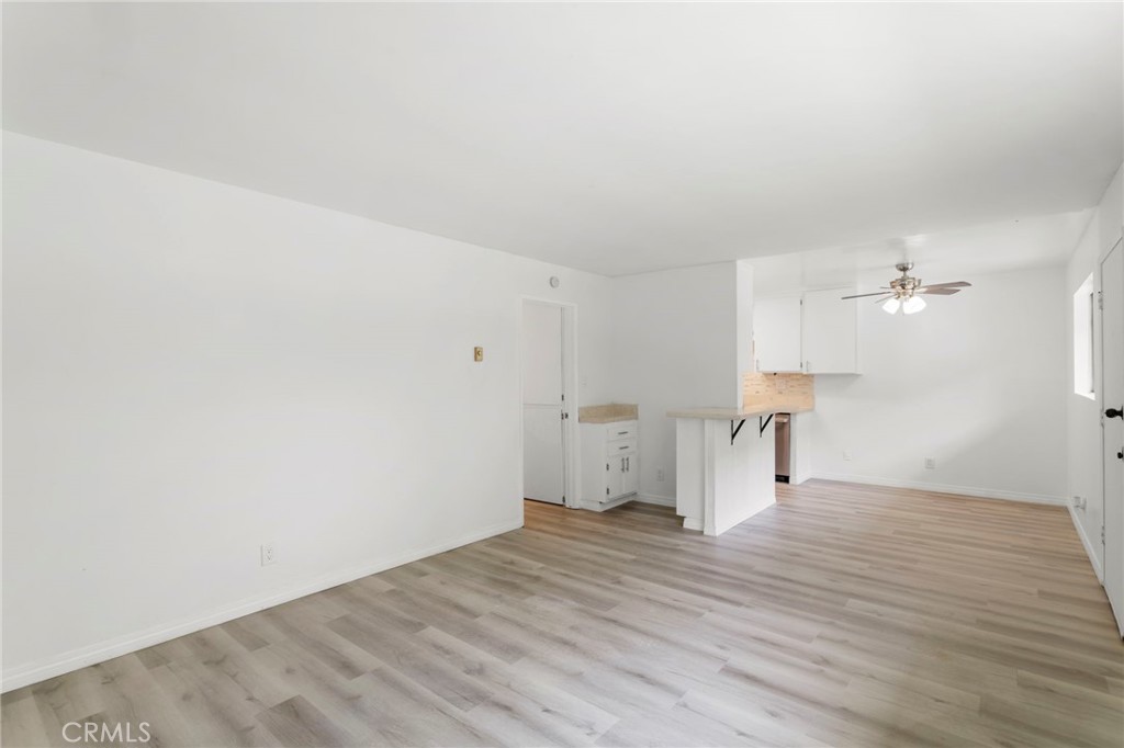 5535 Ackerfield Avenue, Unit 8 Long Beach, CA 90805 - Photo 5 of 31 a view of empty room with wooden floor