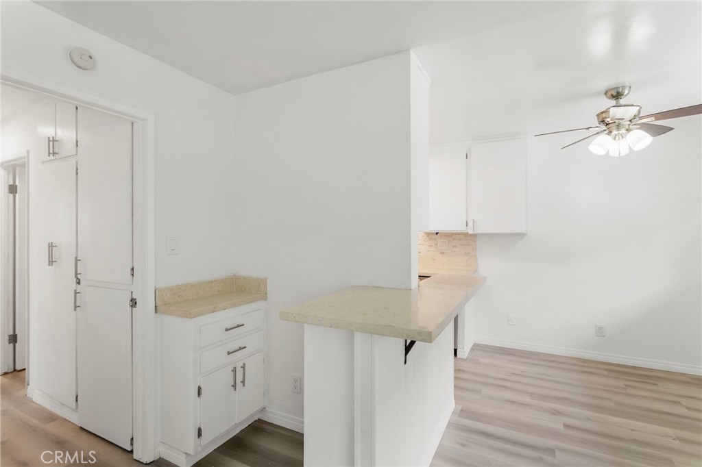 5535 Ackerfield Avenue, Unit 8 Long Beach, CA 90805 - Photo 8 of 31 wooden floor in an empty room