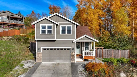 a front view of a house with garden