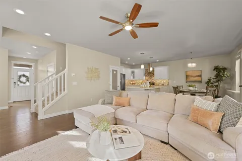 a dining room with furniture and a view of kitchen