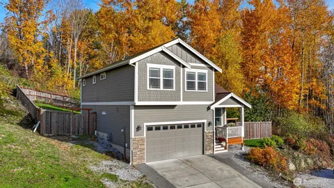 a front view of a house with a yard