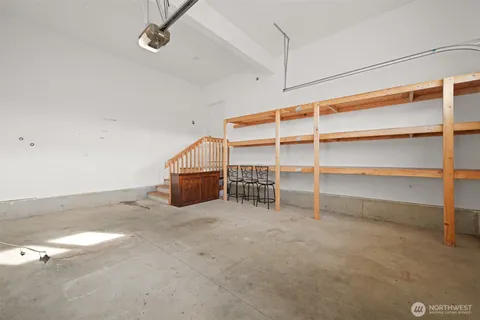 a view of an empty room with a staircase