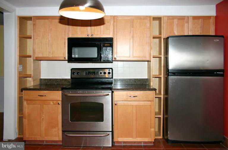 4835 Maple Grove Road Hampstead, MD 21074 - Photo 14 of 27 a kitchen with a stove and a microwave