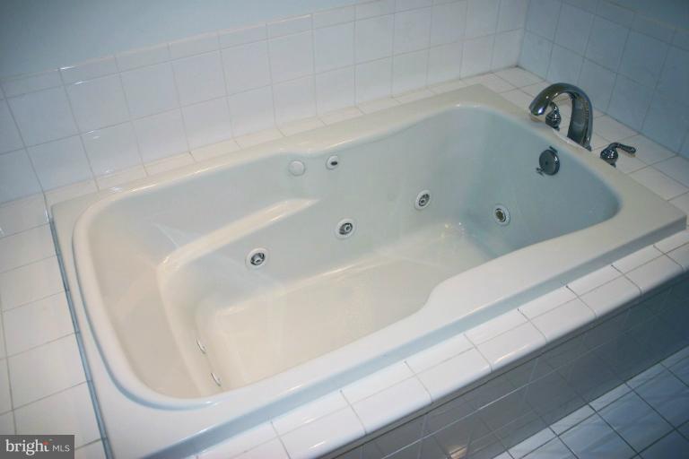 4835 Maple Grove Road Hampstead, MD 21074 - Photo 20 of 27 a bathroom with a bathtub
