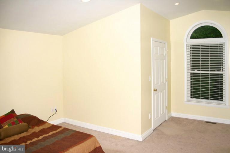 4835 Maple Grove Road Hampstead, MD 21074 - Photo 24 of 27 a bedroom with a bed and a window