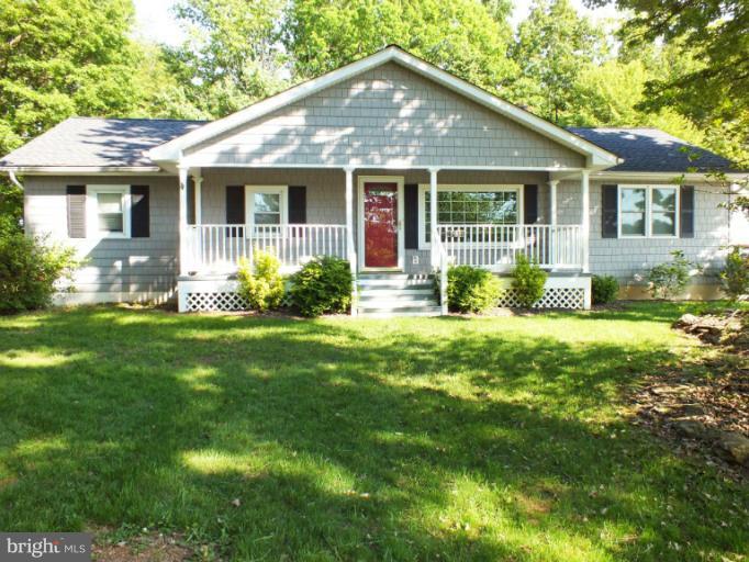 4835 Maple Grove Road Hampstead, MD 21074 - Photo 27 of 27 a front view of a house with yard and green space