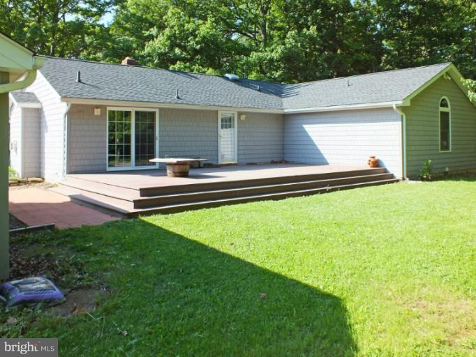 4835 Maple Grove Road Hampstead, MD 21074 - Photo 4 of 27 a view of house with backyard space and garden