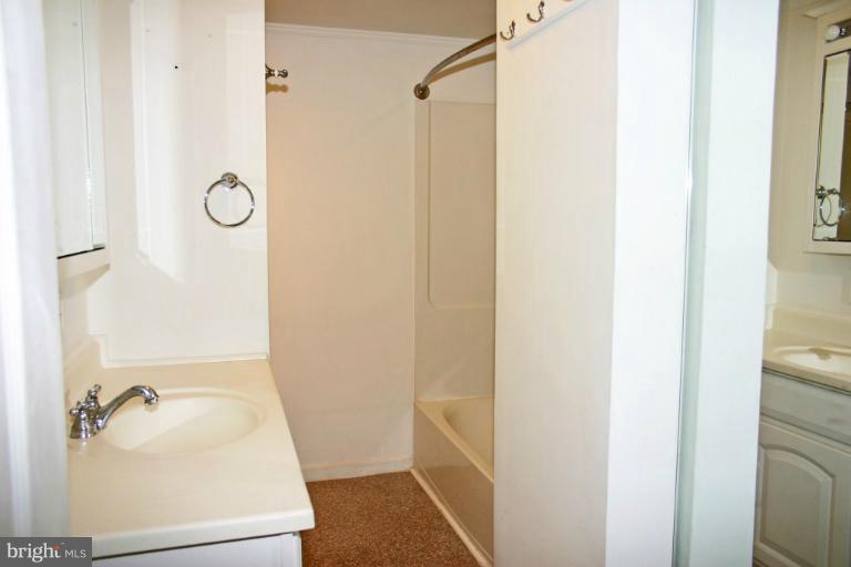 4835 Maple Grove Road Hampstead, MD 21074 - Photo 6 of 27 a bathroom with a sink and shower