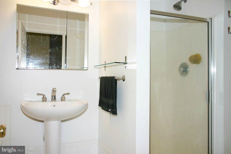 4835 Maple Grove Road Hampstead, MD 21074 - Photo 7 of 27 a bathroom with a sink and a mirror