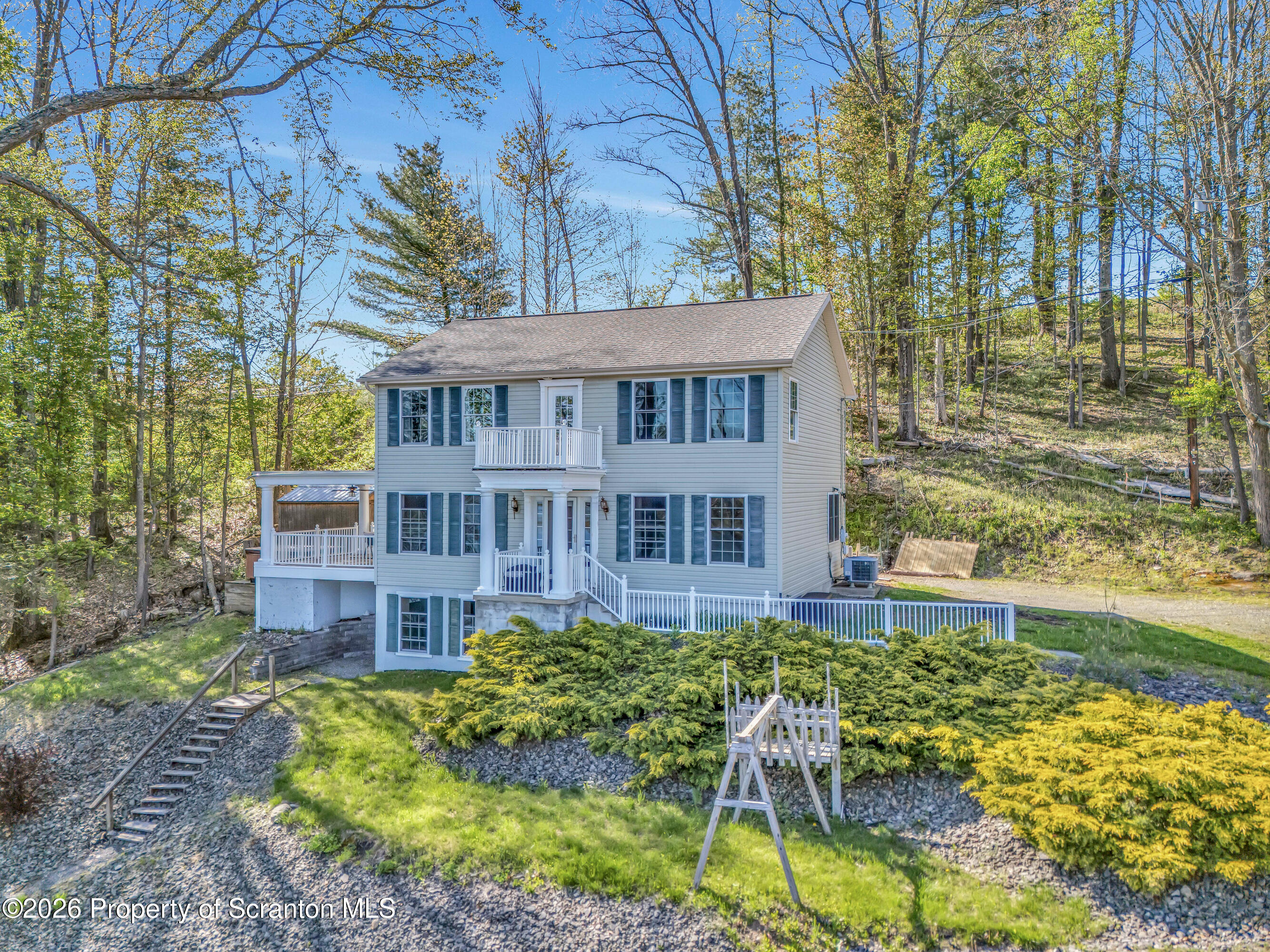 155 Baylor Road Nicholson, PA 18446 - Photo 22 of 53 a view of a house with a yard and sitting area