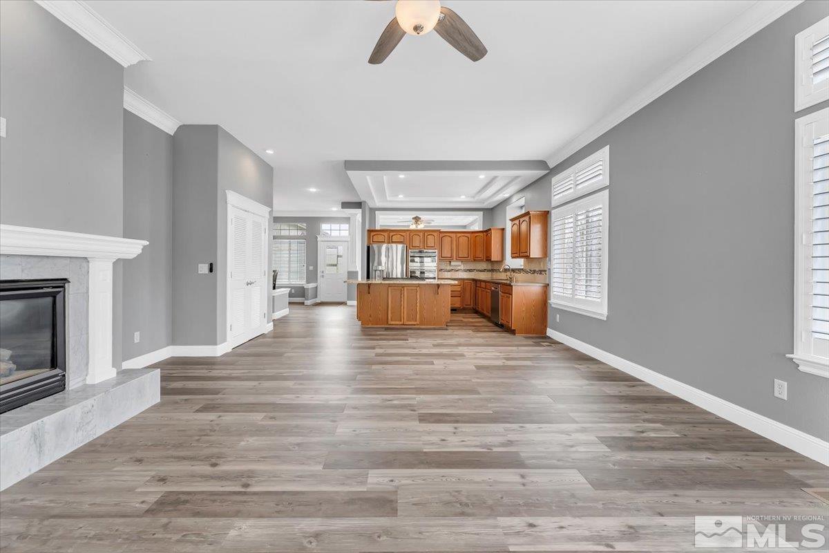 1900 Hidden Meadows Drive Reno, NV 89502 - Photo 8 of 37 a view of empty room with wooden floor and fireplace