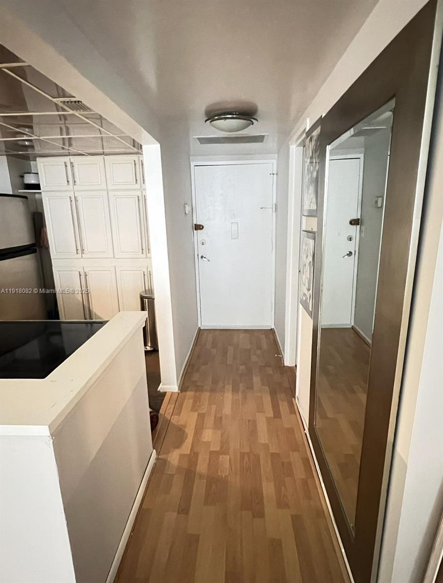 1228 West Avenue, Unit 911 Miami Beach, FL 33139 - Photo 7 of 24 a view of bathroom with wooden floor
