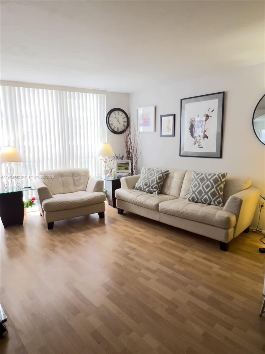 1228 West Avenue, Unit 911 Miami Beach, FL 33139 - Photo 9 of 24 a living room with furniture and a large window