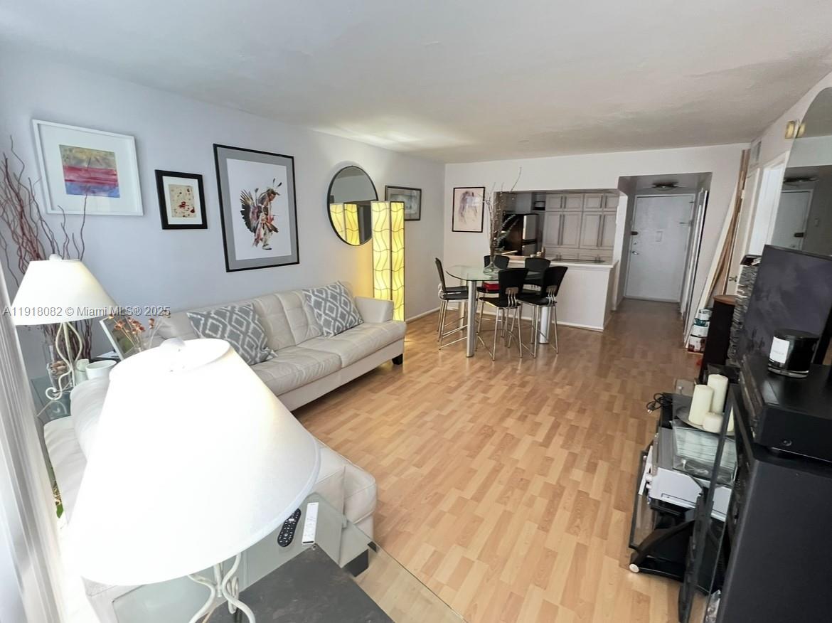 1228 West Avenue, Unit 911 Miami Beach, FL 33139 - Photo 10 of 24 a living room with furniture and a table