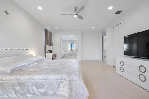 a bathroom with a double vanity sink mirror and shower