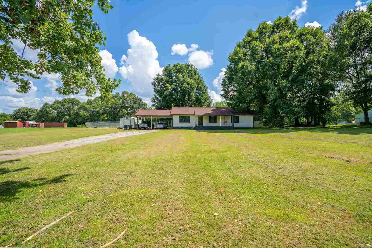 a view of a swimming pool with an outdoor space and seating area