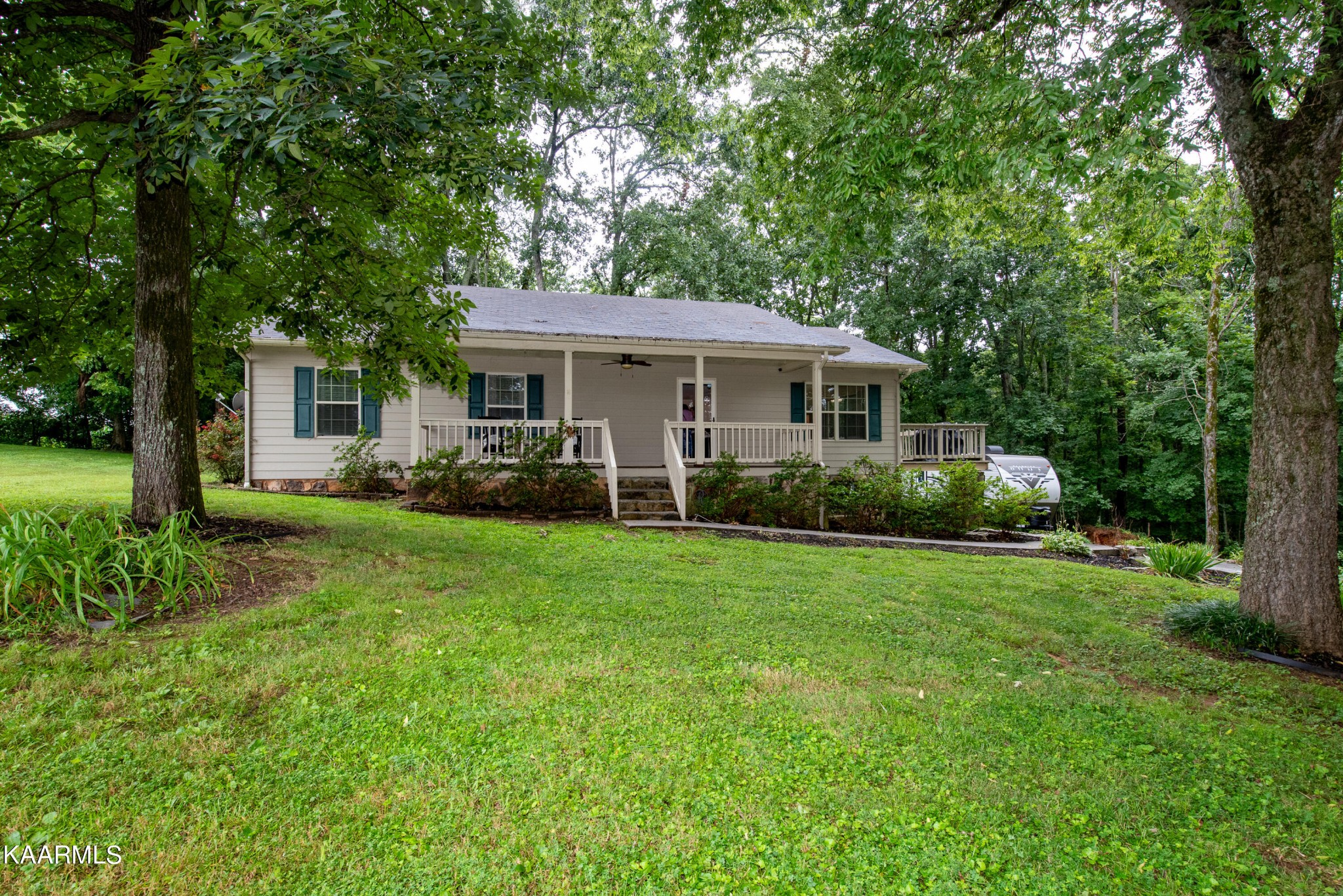 125 Lakeview Estates Road Vonore, TN 37885 - Photo 2 of 46 a view of a house with backyard and garden