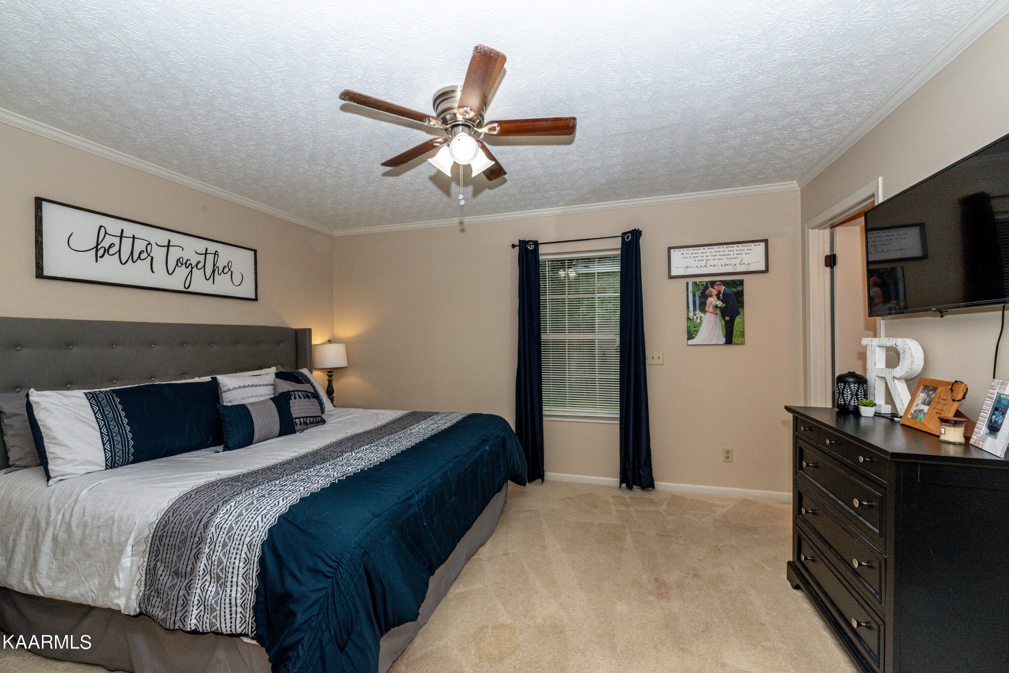 125 Lakeview Estates Road Vonore, TN 37885 - Photo 23 of 46 a bedroom with a bed and a flat screen tv