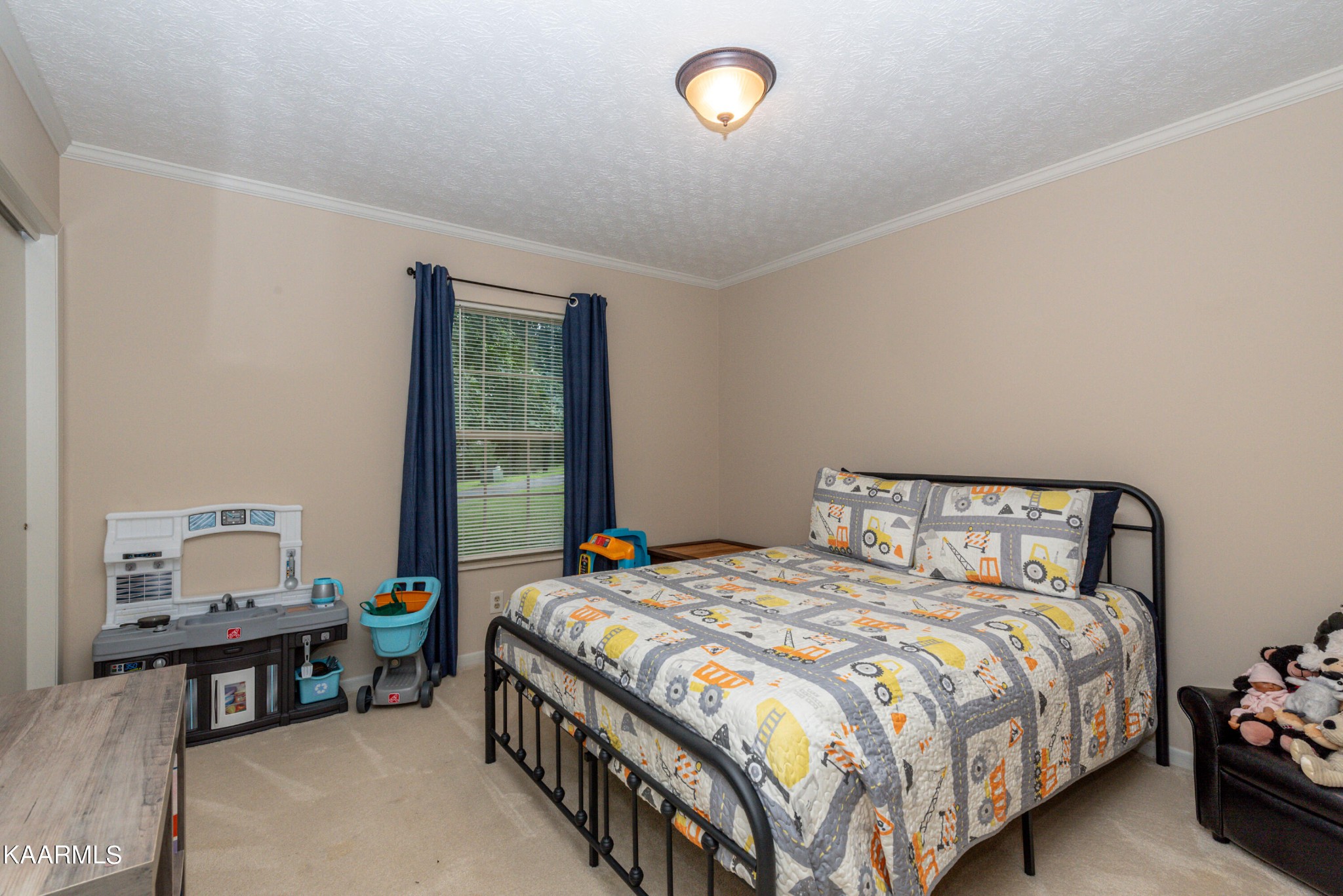 125 Lakeview Estates Road Vonore, TN 37885 - Photo 26 of 46 a bedroom with a bed and a window