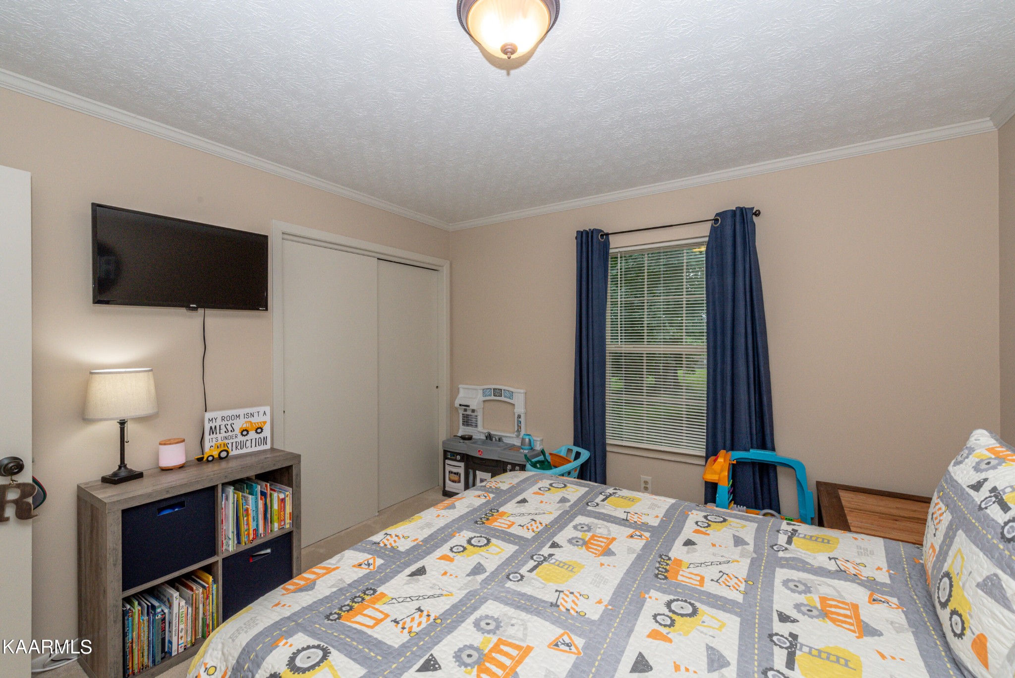 125 Lakeview Estates Road Vonore, TN 37885 - Photo 27 of 46 a bedroom with a bed and a tv