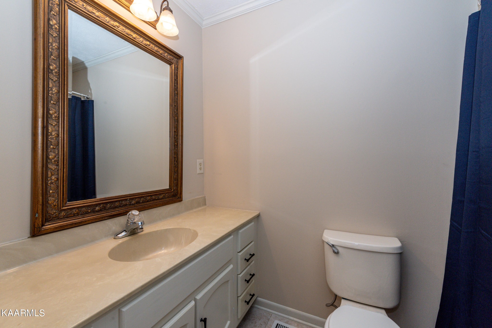 125 Lakeview Estates Road Vonore, TN 37885 - Photo 30 of 46 a bathroom with a granite countertop toilet sink and mirror